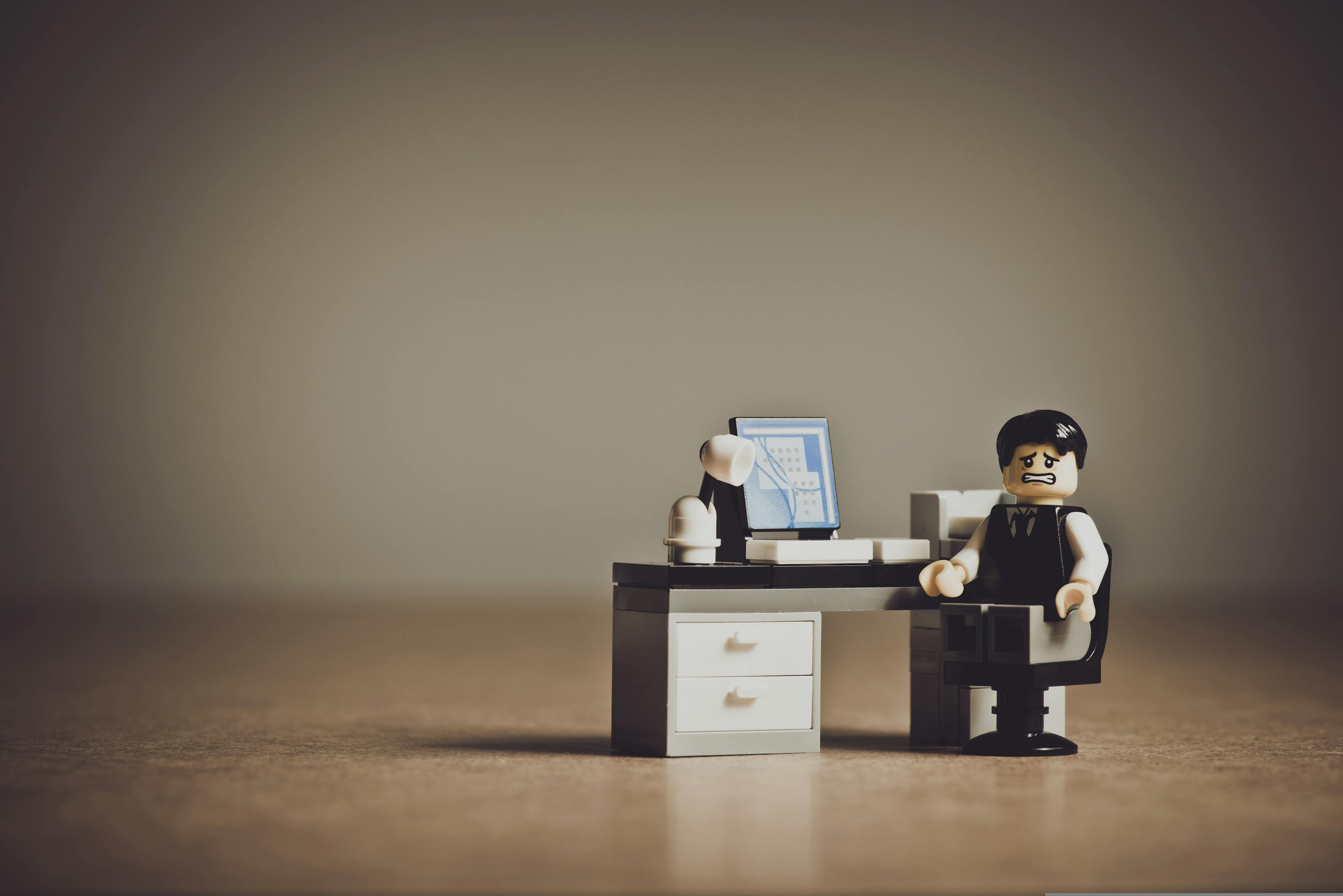 frustrated lego business minifig at a computer